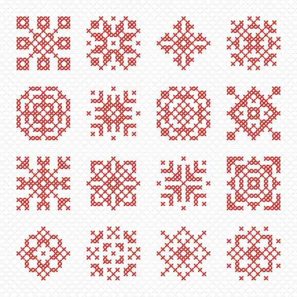 Verzameling van vector cross stitch sneeuwvlokken en bloemen. — Stockvector