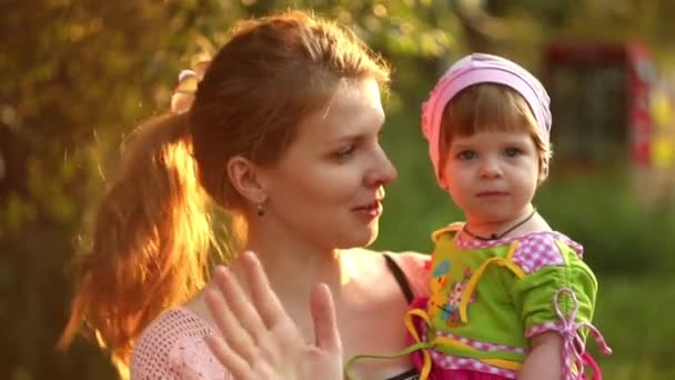 Mother holding her child in her arms — Stock Video