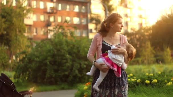 Mother holding her child in her arms — Stock Video