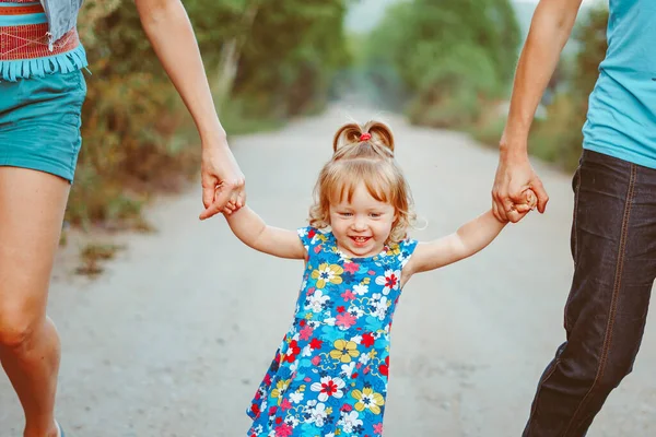 Parents Walk Child Holding Hands Child Laughs — Stock Photo, Image