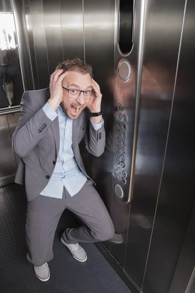 Businessman screaming in the elevator — Stock Photo, Image