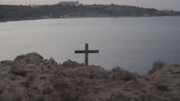Wooden Cross On A Rock Above The Sea — Stock Video