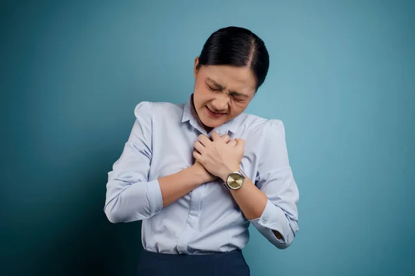 Asian Woman Sick Chest Pain Standing Isolated Blue Background — Stock Photo, Image