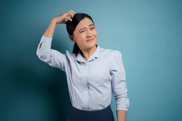 Asian Woman Bored Annoyed Scratching Her Head Isolated Blue Background — Stock Photo, Image