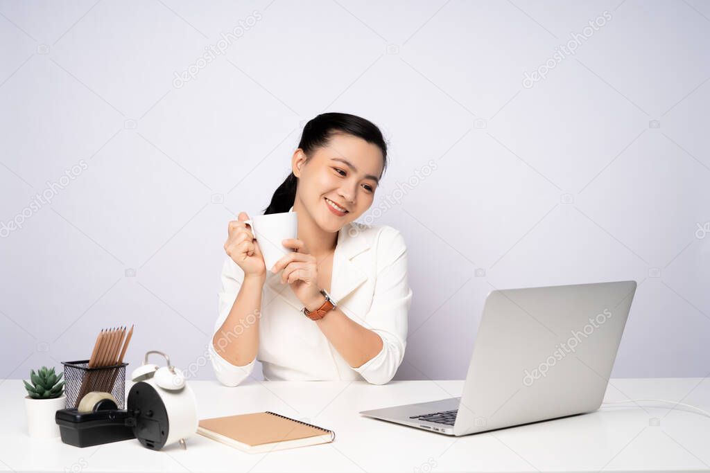 Asian woman happy smiling take a break after working on a laptop. isolated on white background.