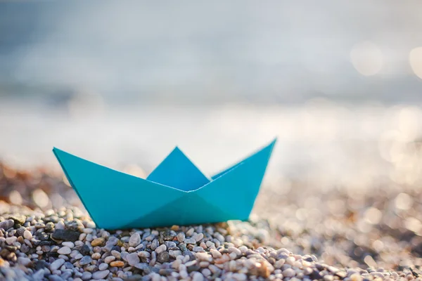 Paper boat on beach — Stock Photo, Image