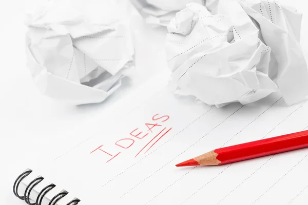 Sheet of paper and red pencil — Stock Photo, Image