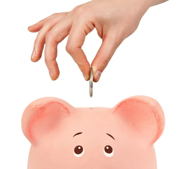 Sparschwein und Hand mit Münze — Stockfoto