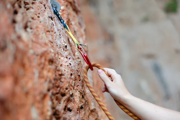 rock climber's hand on handhold