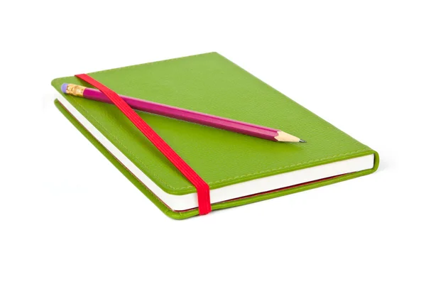 Cuaderno y lápiz rojo — Foto de Stock