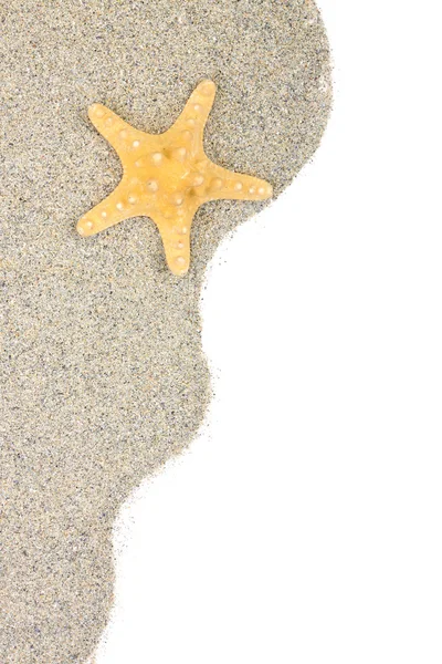 Yellow starfish on sand — Stock Photo, Image