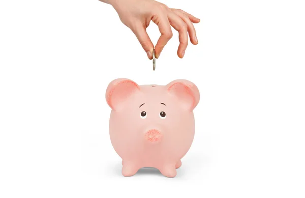 Sparschwein und Hand mit Münze — Stockfoto