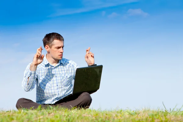 Young man with laptop — Stock Photo, Image