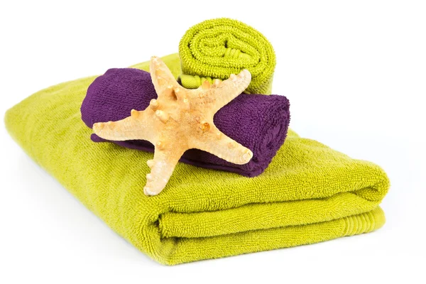 Kleurrijke handdoeken met zeester — Stockfoto