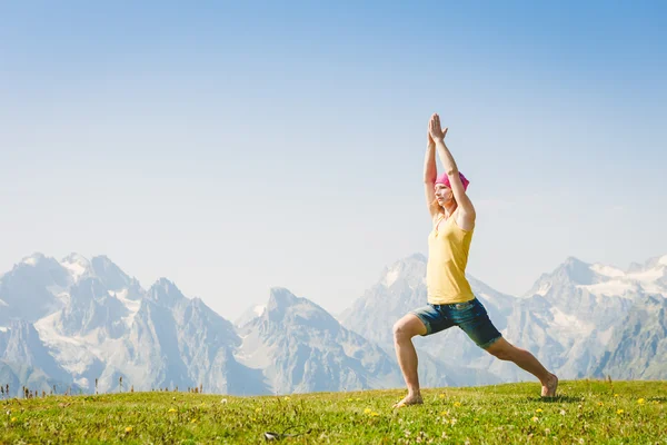 Woman in yoga pose standing — Stock Photo, Image