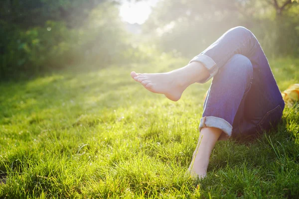 woman lying on grass