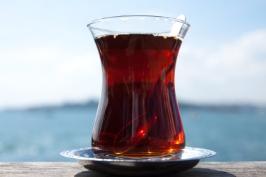 Turkish tea in traditional glass cup clipart