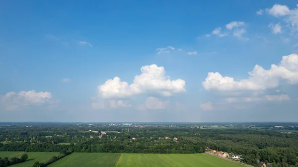 Land or landscape of green field in aerial view. Include agriculture farm, house building, village. That real estate or property. Plot of land for housing subdivision, development, sale or investment. — Stock Photo, Image