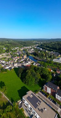 Sougne-Remouchamps, Aywaille, Liege, Wallonie, Belgium, August 10, 2025, A stunning aerial landscape displays a serene countryside filled with a winding river and charming homes