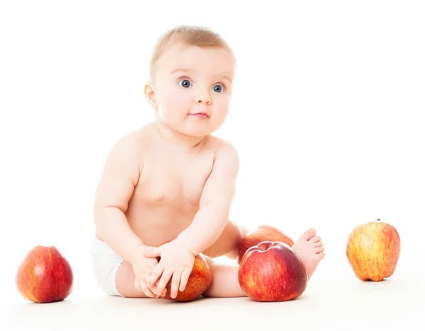 Vacker baby med äpplen — Stockfoto