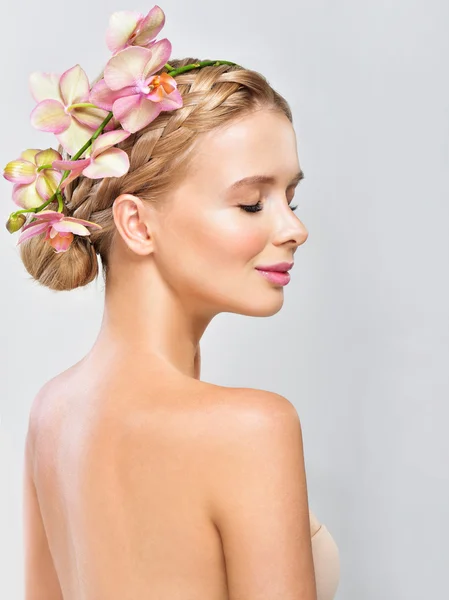 Beautiful woman with Orchid Flowers — Stock Photo, Image