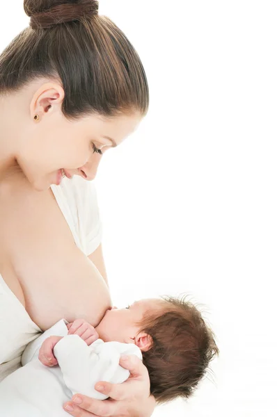 Young mother breastfeeds her baby Stock Photo