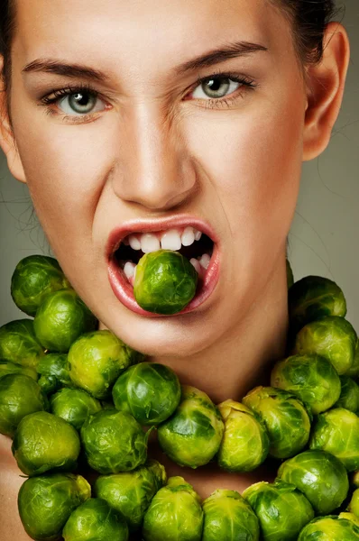 Beautiful woman with Brussels sprouts — Stock Image Beautiful woman with Brussels sprouts Stock Image
