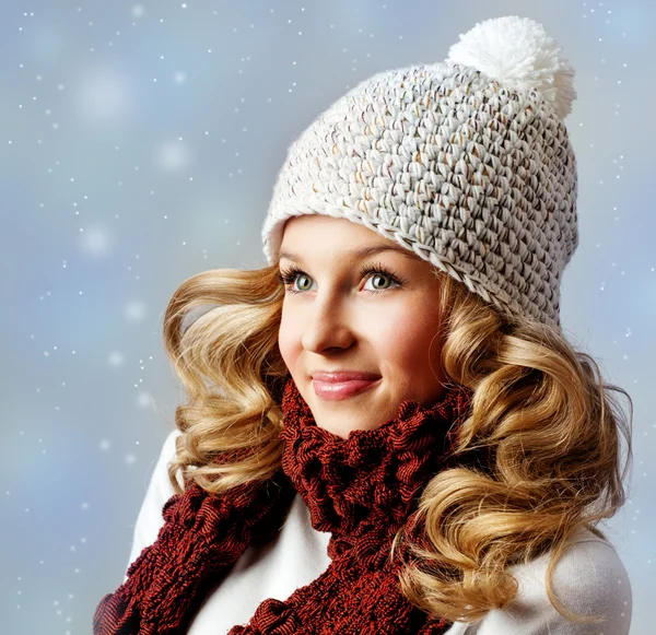 Cheerful woman in warm hat