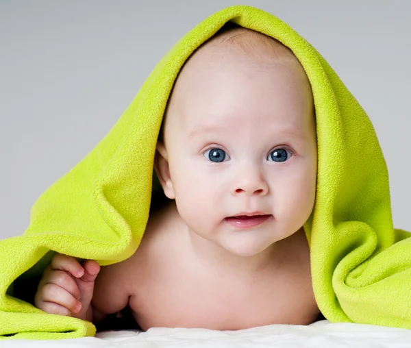 Beautiful baby in a towel after bath — Stock Photo, Image