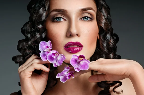 Beautiful brunette with curly hair — Stock Photo, Image