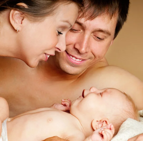 Happy young family with baby — Stock Photo, Image