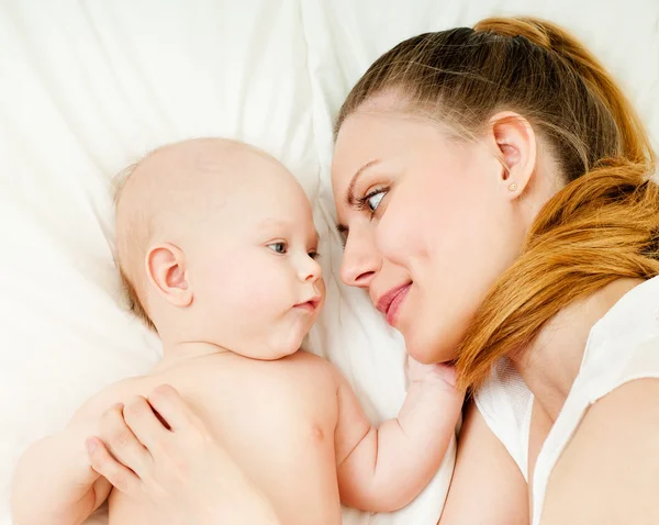 Mother and baby playing and smiling Royalty Free Stock Photos