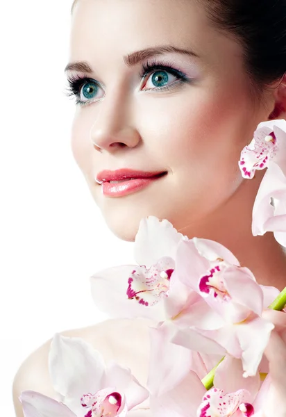 Mädchen mit rosa Orchidee — Stockfoto