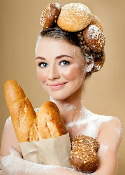 Beautiful woman with fresh fragrant bread — Stock Photo, Image