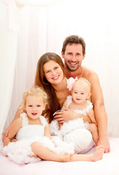 Happy young family with babies — Stock Photo, Image