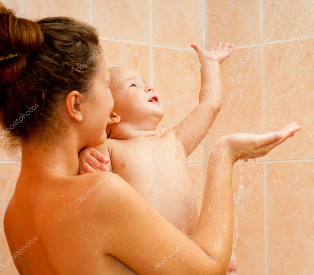 Mother and baby daughter in the shower together. 