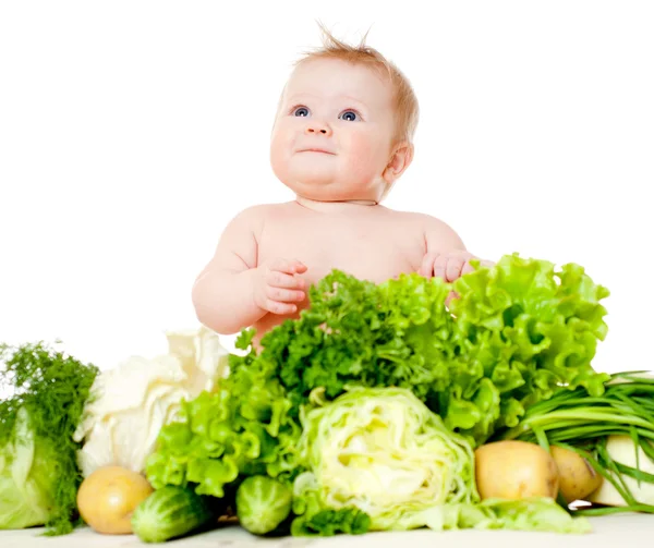 Bebê bonito com legumes — Fotografia de Stock