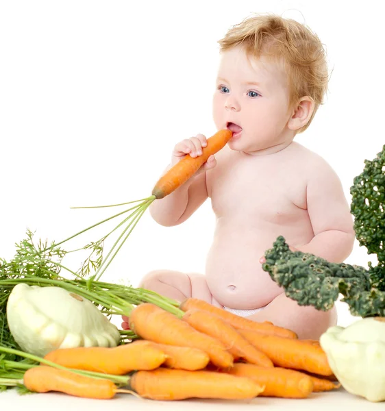 Bebê bonito com legumes — Fotografia de Stock