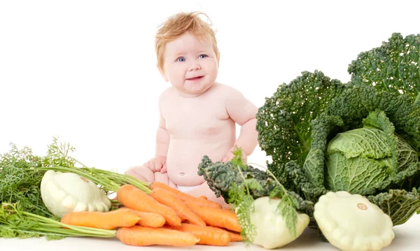 Bebê bonito com legumes — Fotografia de Stock