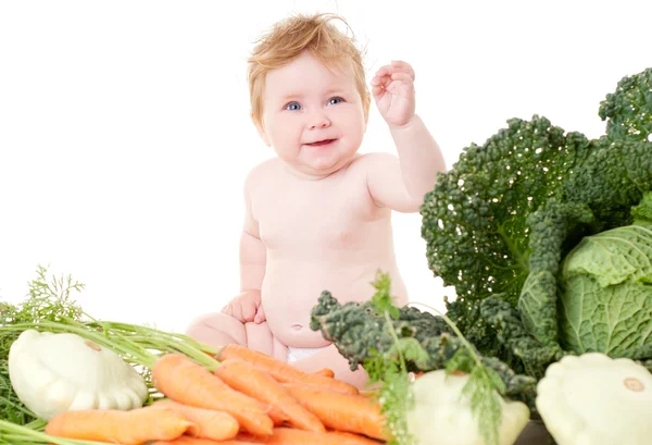 Bebê bonito com legumes — Fotografia de Stock