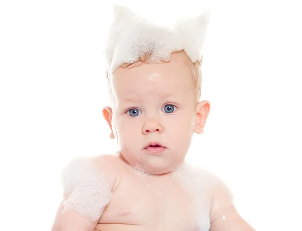 Niño en la espuma de jabón — Foto de Stock