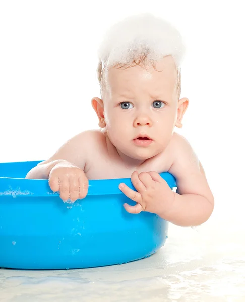 Criança na espuma de sabão — Fotografia de Stock