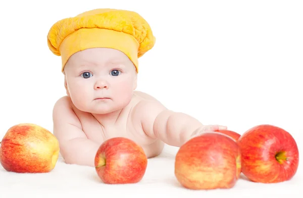 Söt baby med äpplen — Stockfoto