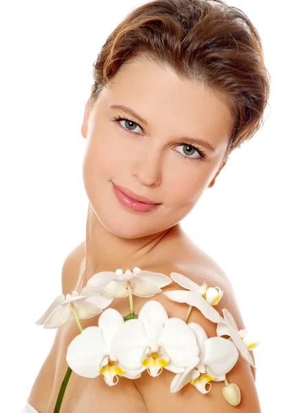 Mujer joven con orquídea — Foto de Stock