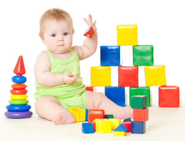 Meisje van de baby met speelgoed — Stockfoto