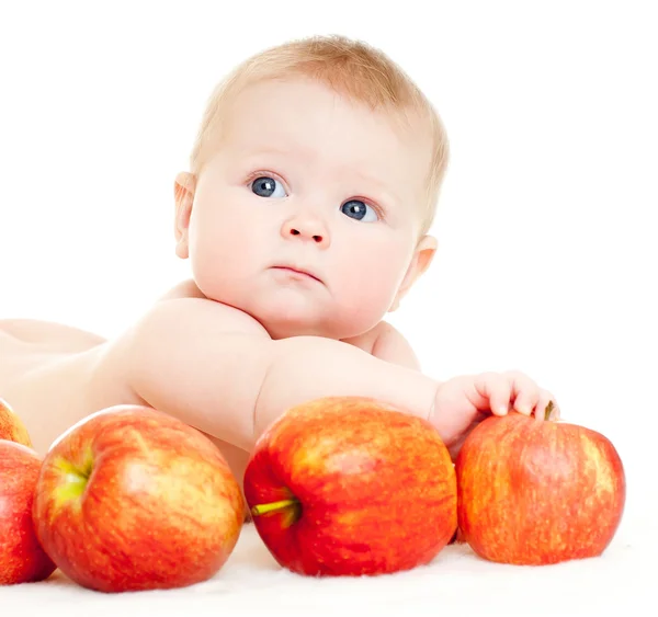 Bebê com maçãs vermelhas — Fotografia de Stock