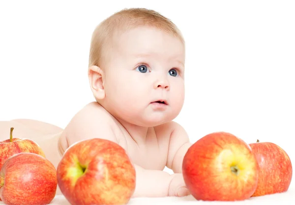Baby met rode appels — Stockfoto