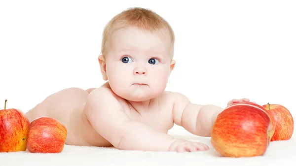 Baby met rode appels — Stockfoto