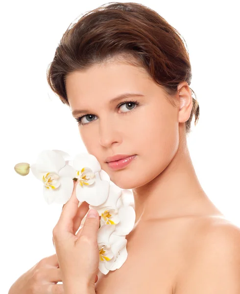 Mujer joven con orquídea — Foto de Stock