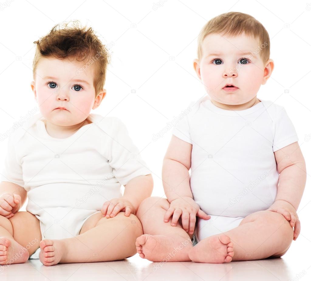 Two lovely kids in hats, isolated